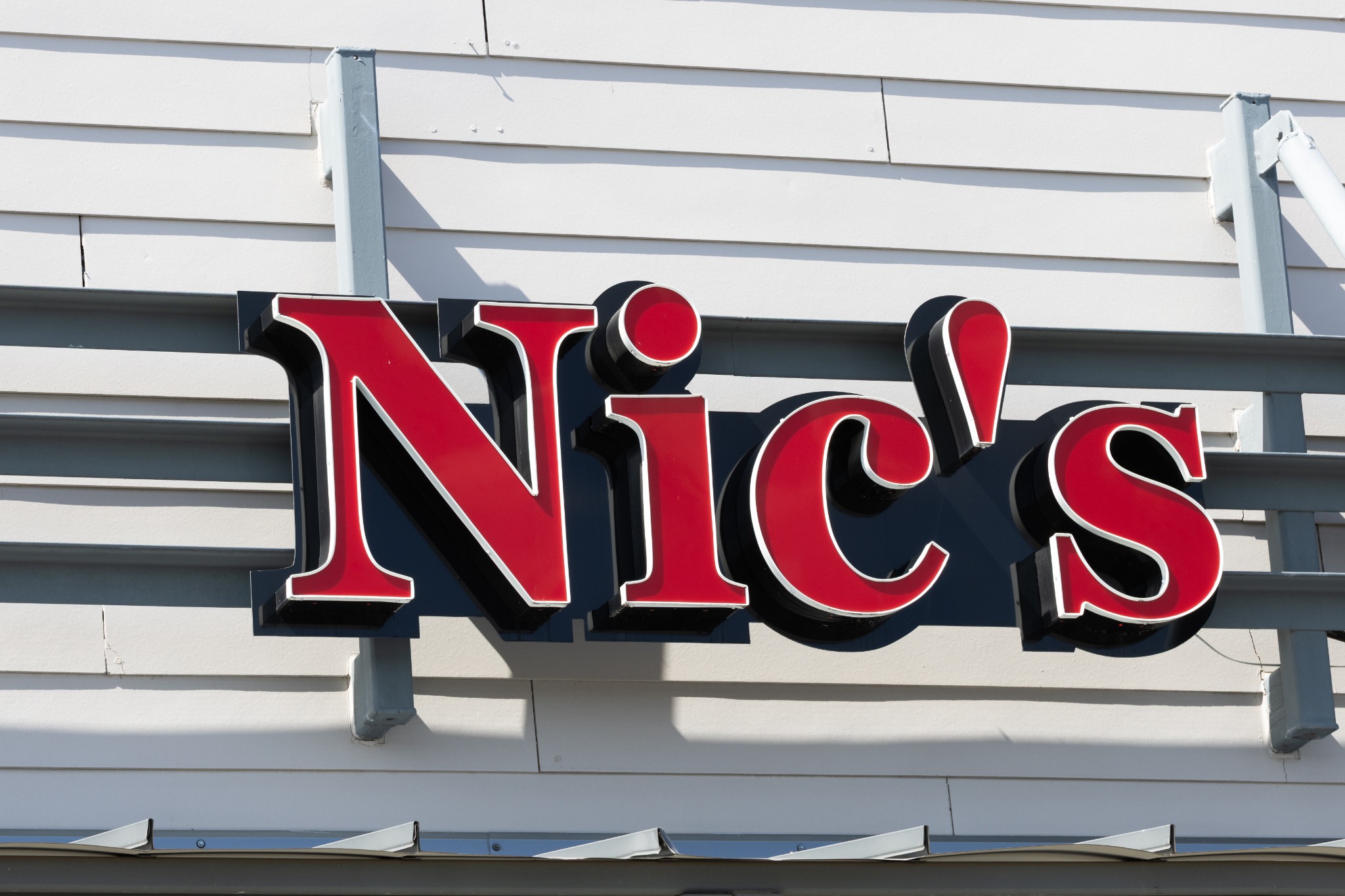 Real photograph of the Nic’s storefront sign